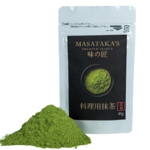 Pouch of Masatakas premium select Matcha, 40g includes a pile of loose matcha infront of the pouch